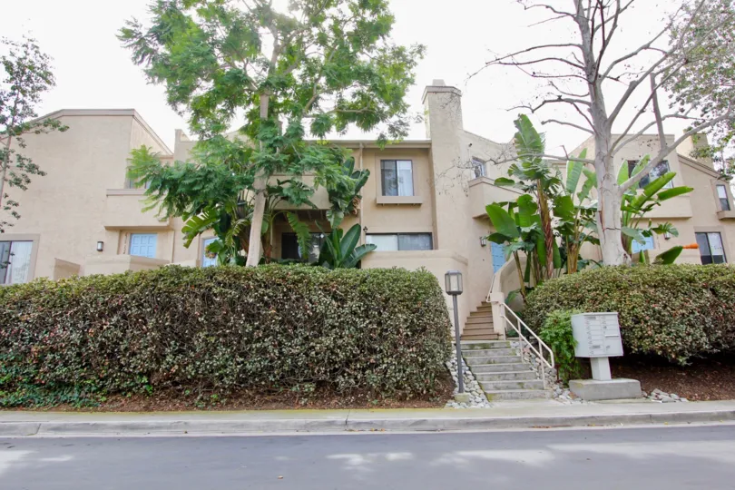 The road frontage view of a house in Woodlands South of La Jolla, California