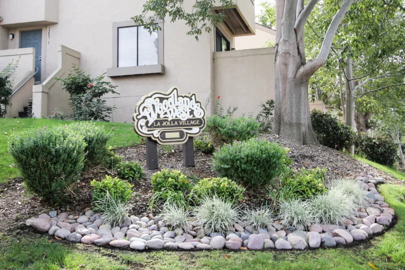 Sign in garden area for Woodlands West I community in La Jolla