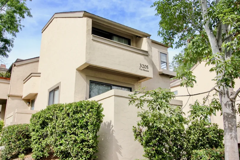 Multi level residental building with the number 3205 labeled in the woodlands west I community.