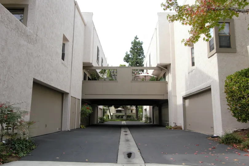 black driveway with storm drain in the middle inside woodlands west ii in la jolla ca