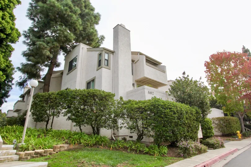 A three-storey townhouse with a common chimney in the Woodlands West II community.