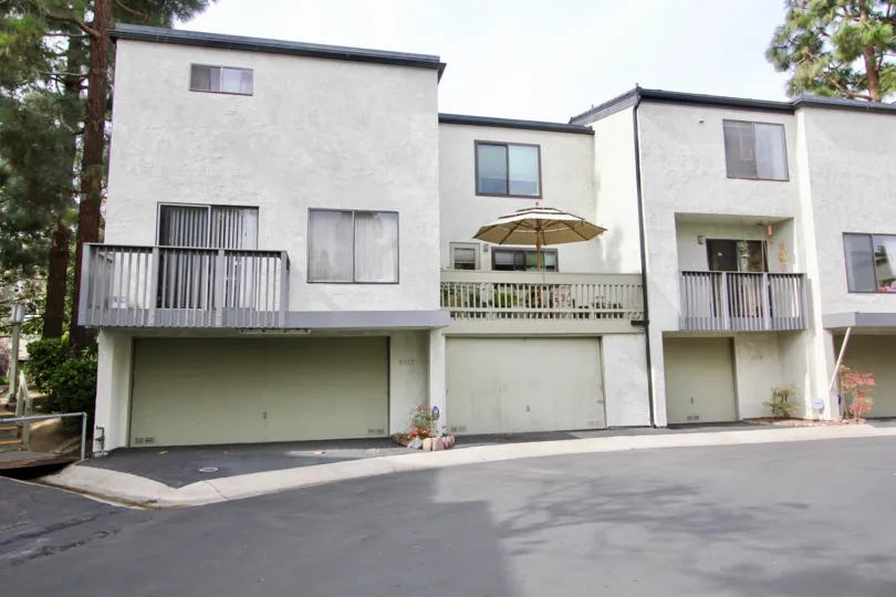 Three story gray and white units in the Woodlands at La Jolla CA
