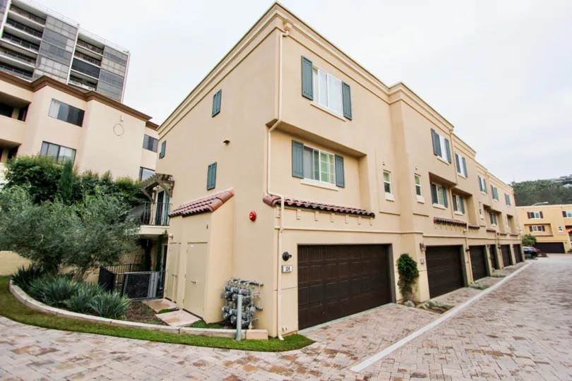 A row of garages built into residential units inside Ziani in La Jolla CA