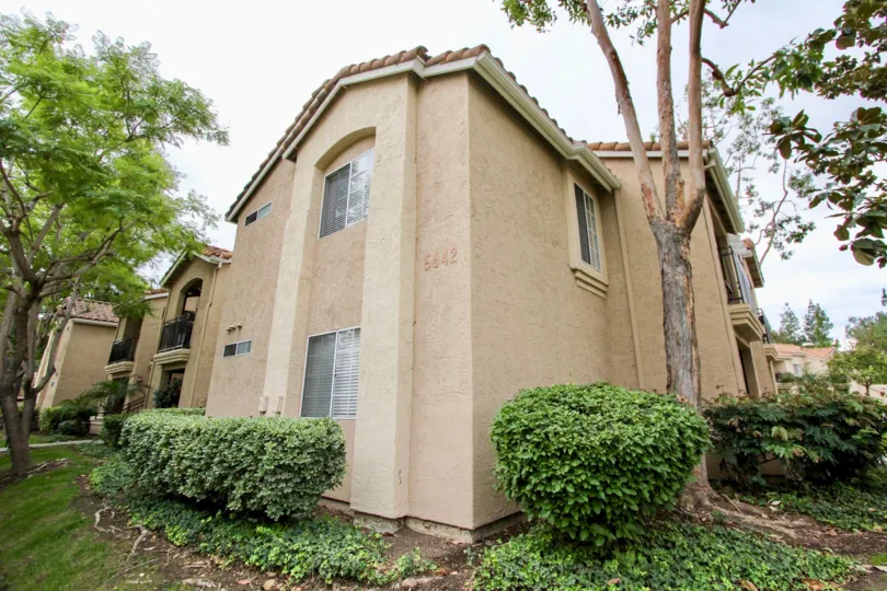 Building with 5642 number and has trees and bushes in Central park La Mesa