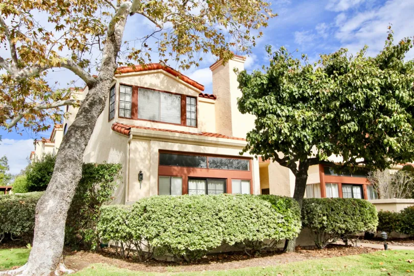 Bright sunny day with nice garden trees in front of a Villa in Daybreak of La Mesa