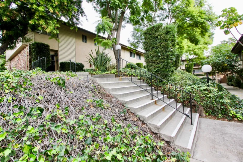An entrance view with greenary of a villa in Grossmont Village of La Mesa