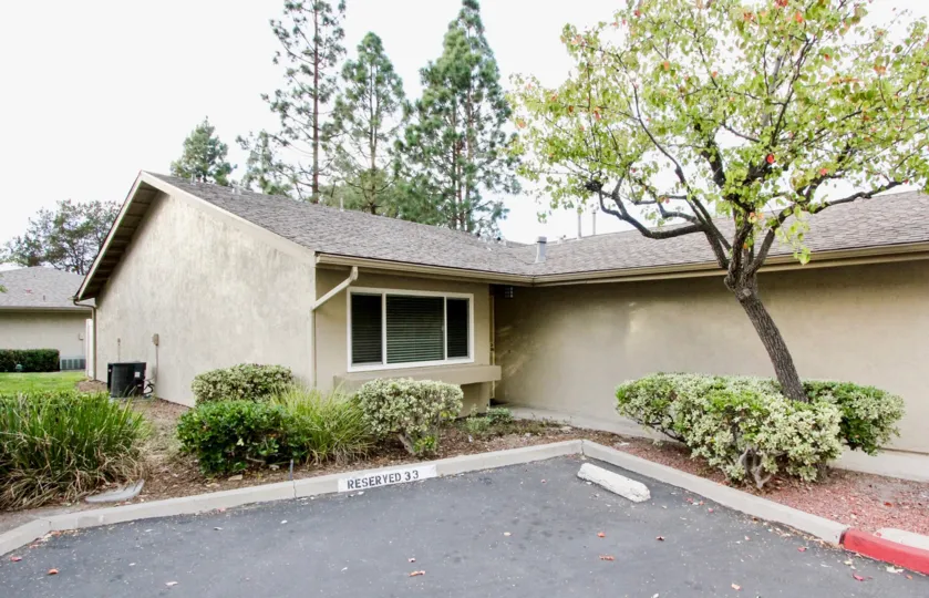 THIS IMAGE SHOWS THAT HOME IN THE LA MESA RACQUET & SWIM CLUB WHICH HAS BEEN TREES, PLANTS