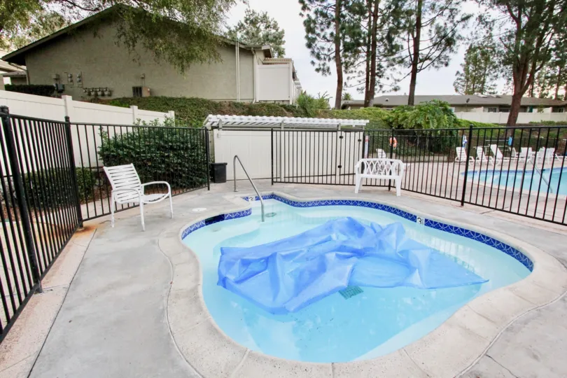 A sunny day in the La Mesa Racquet & Swim Club with a swimming pool.