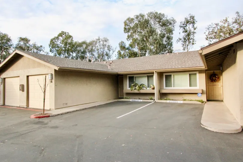 a warm day in the la mesa racquet & swim club with a building that has no roof top
