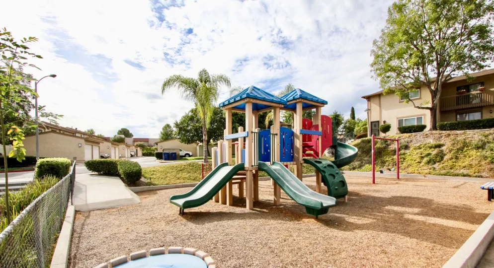 The children's playground with no lawn in the Lake Glen Park neighborhood.
