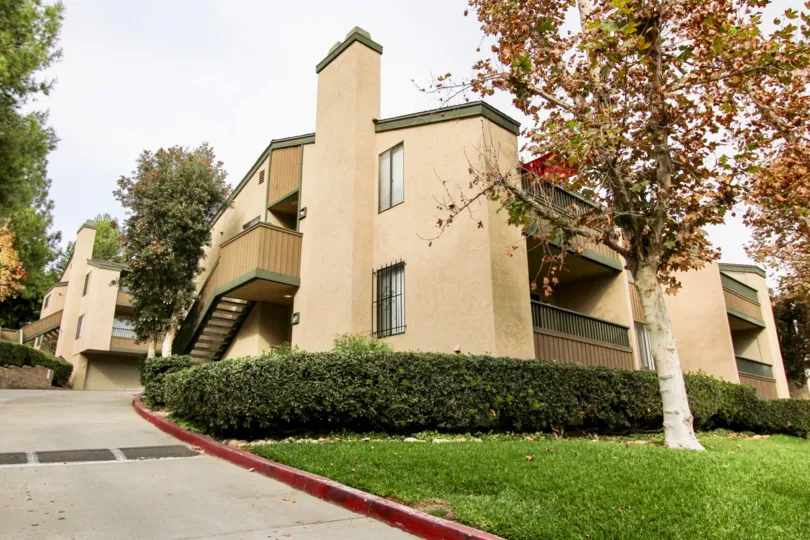 a pleasant day in the parkway manor with a building that has its way slope and garden in its right
