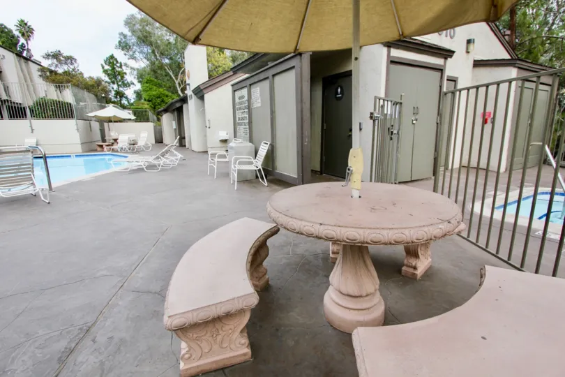 the Parkway Pointe with tables and chairs near to the swimming pool