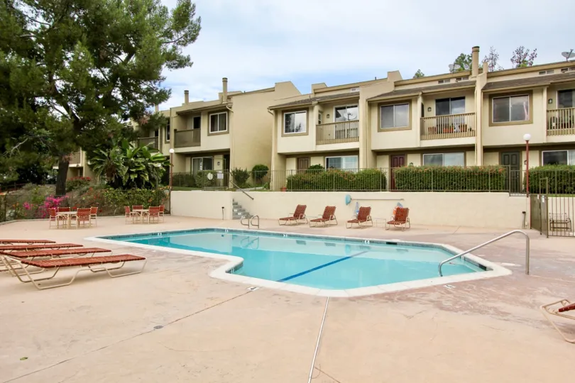 The Parkway Villas with large swimming pool and chairs around