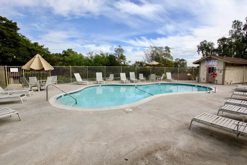 The Strawberry Hills with a swimming pool and chairs around