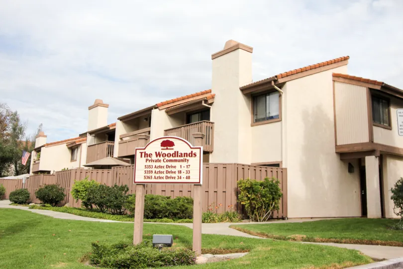 THE HOUSE IN THE WOODLANDS WITH THE WOODLANDS PRIVATE COMMUNITY IN THE GRASSLAND, PLANTS