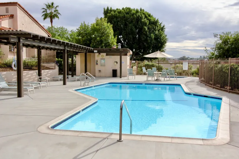 THE BUNGALOW IN THE WOODLANDS WITH THE SWIMMING POOL, TABLES, PLANTS, TREES