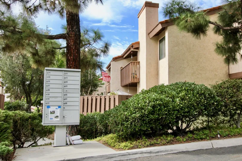 Nice approach of villa with beautiful trees and letter box in The Woodlands of La Mesa