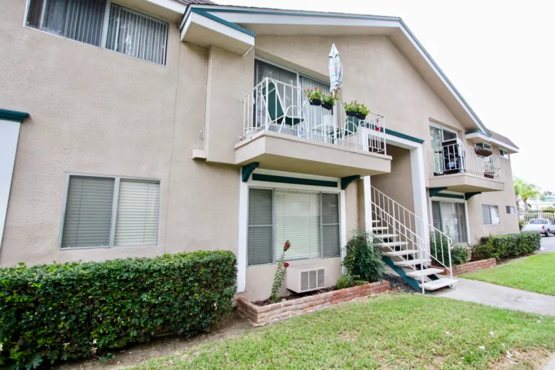 A two story pink Westwood Village building in La Mesa California