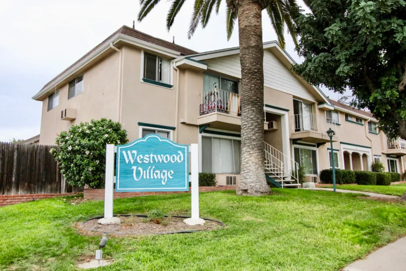 Condo n Westwood Village in La Mesa, Calofirnia, Has green grass and palm right in front yard