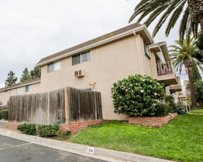a pleasant day in the westwood village with a house that has wooden patition at its side