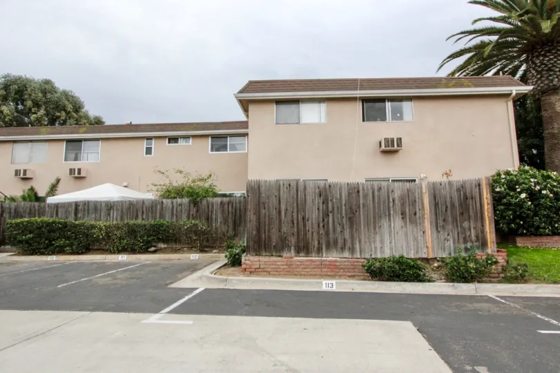 Cloudy day with trees around and parking in Westwood Village of La Mesa