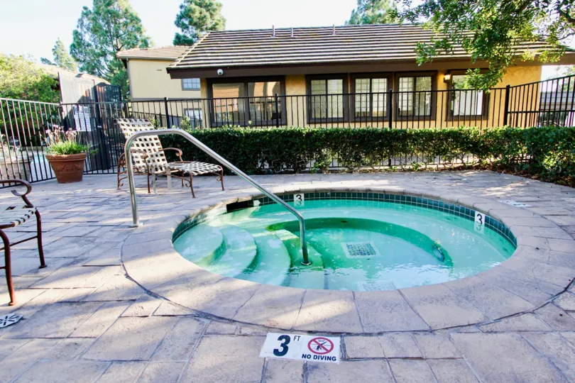 A sunny day, in front of decorative pool with chairs in Arbor Ridge community, Mira Mesa, CA
