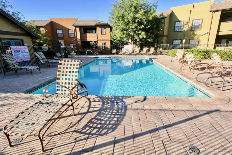 Swimming pool near residential buildings at Arbor Ridge in Mira Mesa California