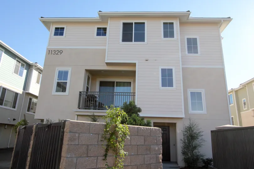 Three story town-home with gated dumpsters at Aura in Mira Mesa California