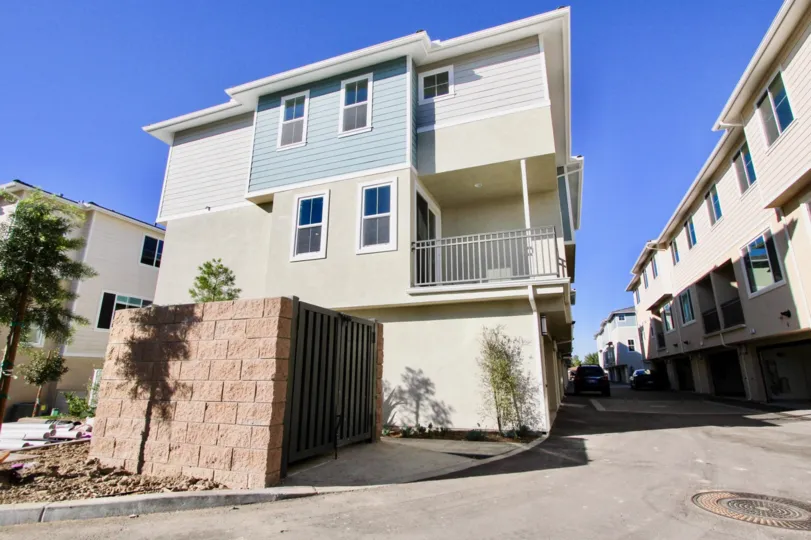 Three story residential units with enclosed dumpster at Aura in Mira Mesa California