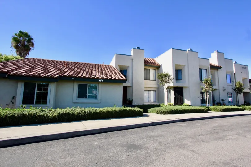 Driveway near two story residential buildings at Black Mountain Villas in Mira Mesa California