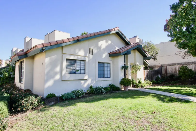A Beautiful green lawn in front of Marvellous House with trees in Black Mountain Villas of Mira Mesa