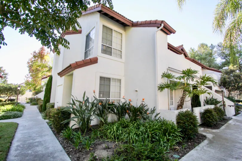 Two story residential building with walkway at Canyon Bluffs in Mira Mesa California