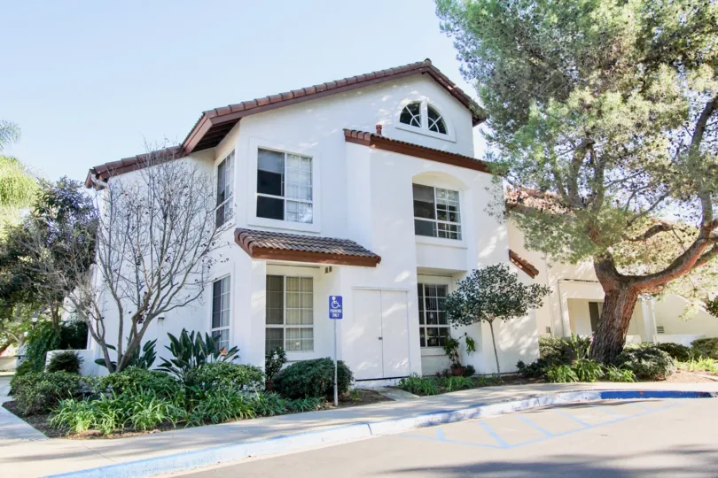 You can see a white house in the clean streets in Canyon Bluffs.