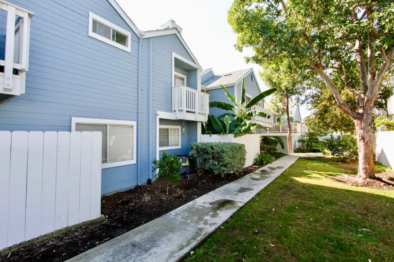 Sidewalk near two story residential buildings at Canyon Colony in Mira Mesa California