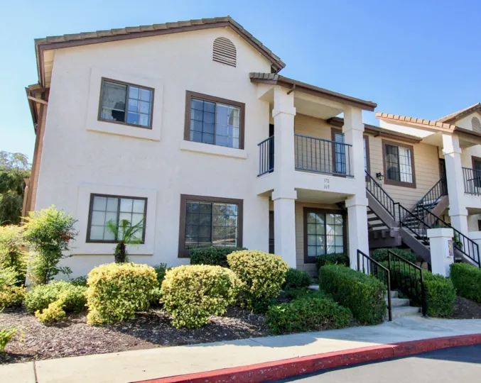 A two-storey residence with an exterior staircase in the Concord Villas community.