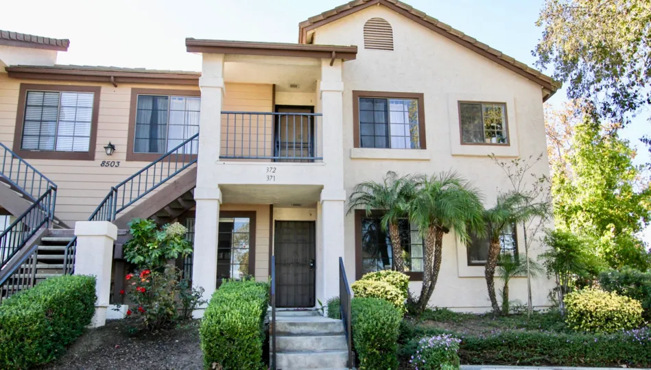 Beautiful House on a sunny day surrounded with Garden and trees in Concord Villas of Mira Mesa