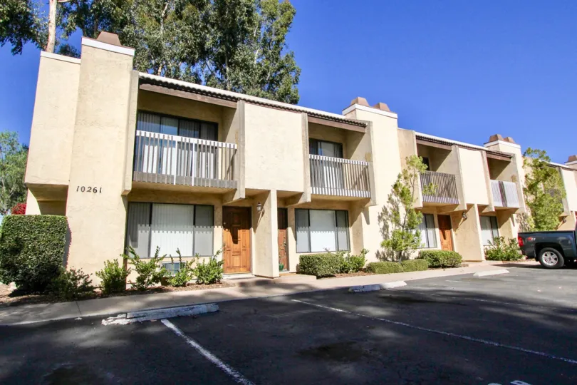 Parking area near a two story residential building at Gold Creek In Mira Mesa California