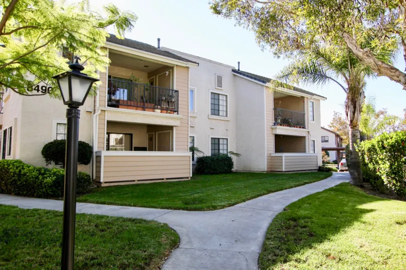 Two story residential units next with a walkway at Heritage at Concord Square in Mira Mesa California
