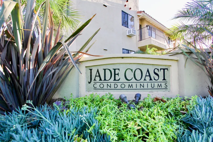 THE JADE COAST CONDOMINIUMS IN THE JADE COAST WITH THE PLANTS, TREE, AIR CONDITIONER, BALCONI