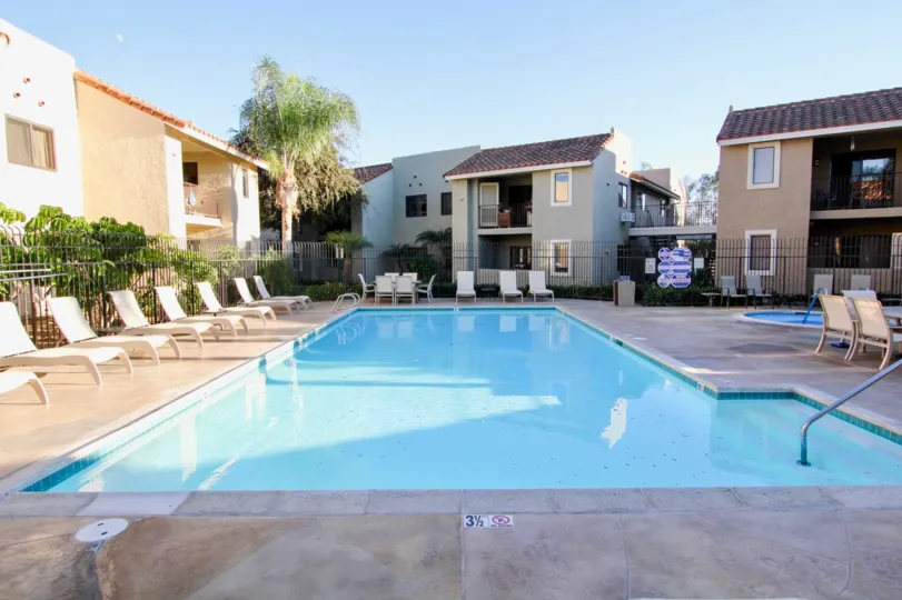 Front pool view with chairs in Jade Coast Community in Mira Mesa, CA