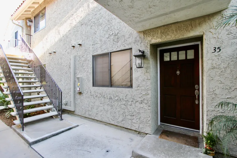 Entrance of a residence near a stairway at Jade Cost in Mira Mesa California