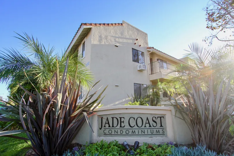 Community sign in front of three story residential units at Jade Coast in Mira Mesa California