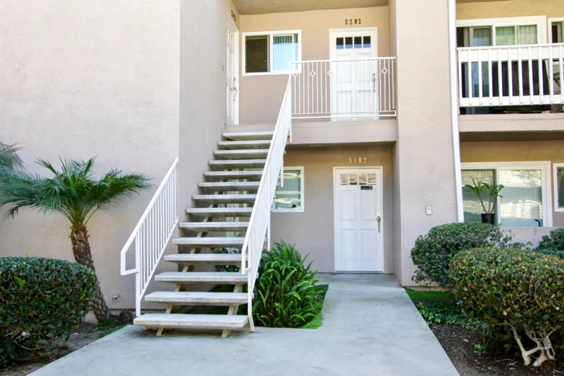 A sunny day in the area of Mirabella Point, stairs, balcony, outside, street, palm tree, door