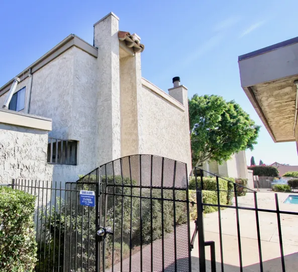 A SHINY DAY IN THE Monterey Village WITH BEAUTIFUL HOUSES AND SMALL GARDEN