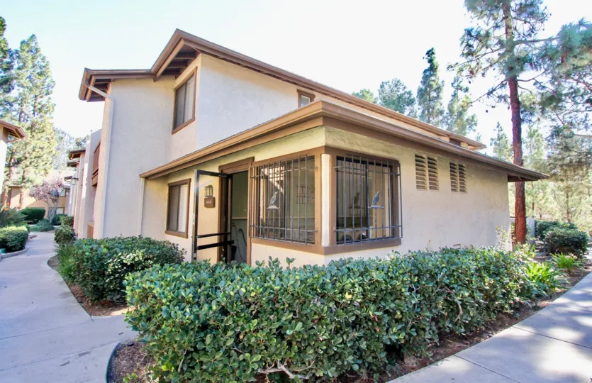 THE HOUSE IN THE QUAIL CREEK WITH THE BIRD, PLANTS, TREES, PATHWAY