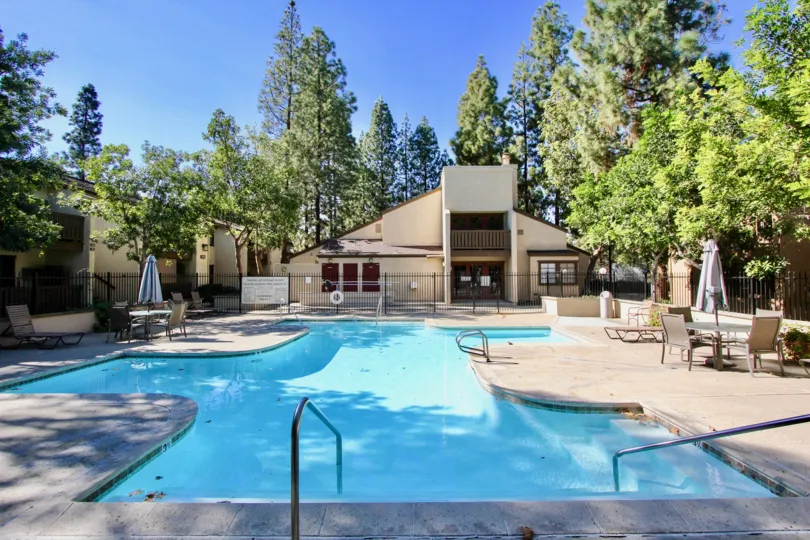 A sunny day in front of pool with table chairs in Quail Creek community, Mira Mesa, CA