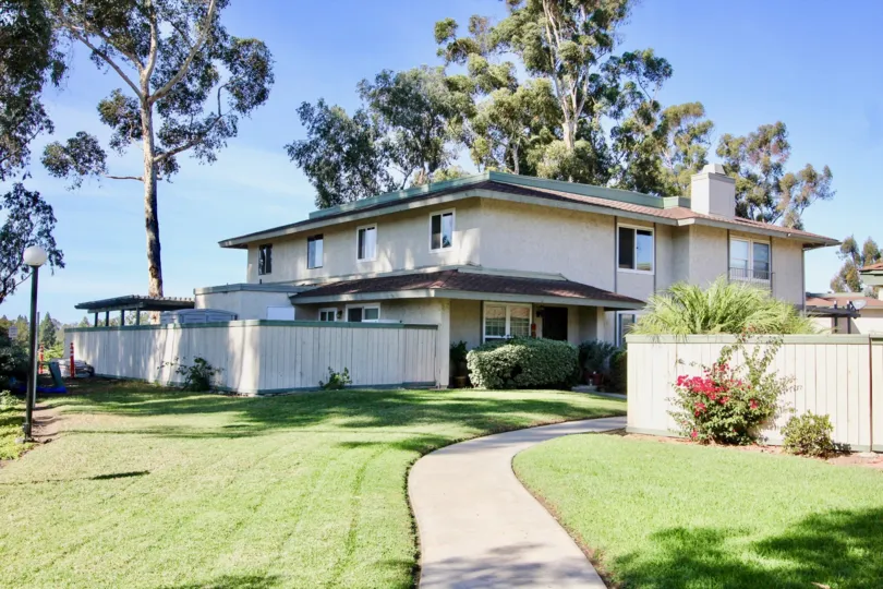 Two story housing units with large patio and green yard at Quest in Mira Mesa California