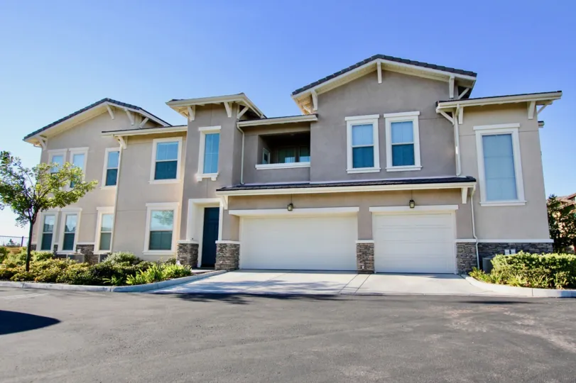 A property with large windows, two garages and a porch at Sorrento Terrace