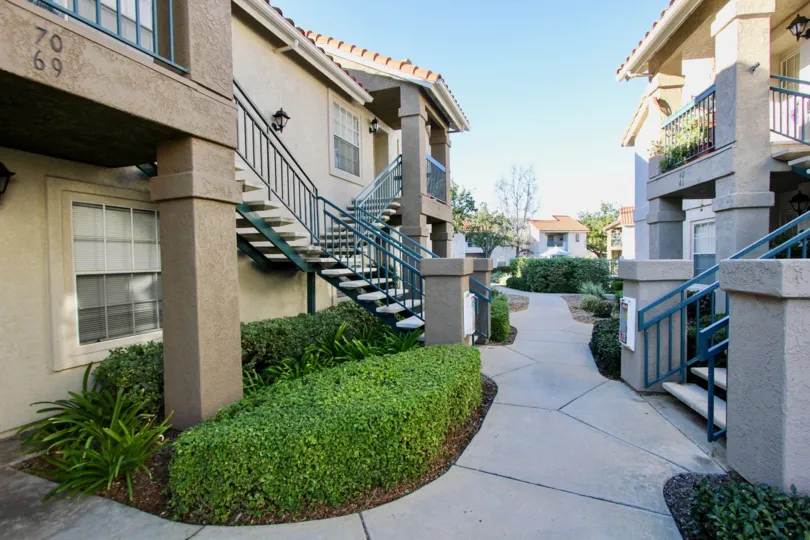 THE 7069 APARTMENT IN THE SUMMIT RIDGE WITH THE UPSTAIRS, PLANTS, PATHWAY