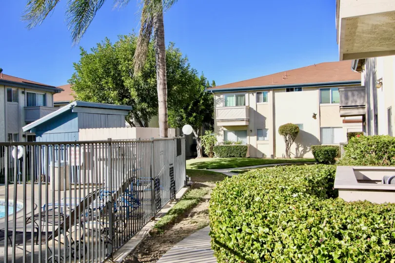Gated pool next to residential buildings at Villa Mar in Mira Mesa California